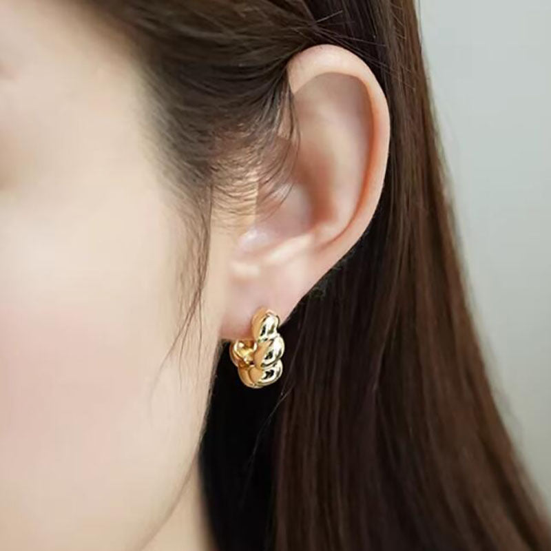 Premium light luxury twist earrings, niche design sense, croissant earrings, ear buckles, unique texture twist earrings